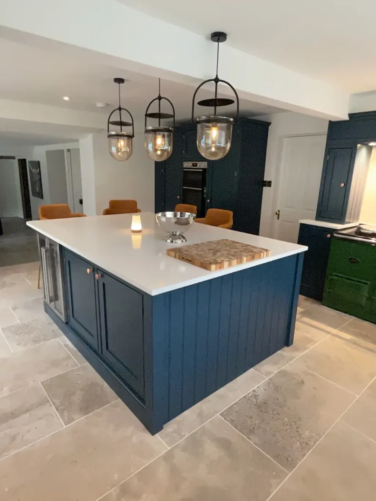Bespoke furniture in North Yorkshire and Teesside: large navy painted kitchen island with white worktop and lantern pendants